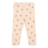 Legging bébé beige imprimé oursons avec petits dessins répétés.