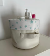 Panier de rangement blanc avec doublure à étoiles vertes et étiquette sur la sangle