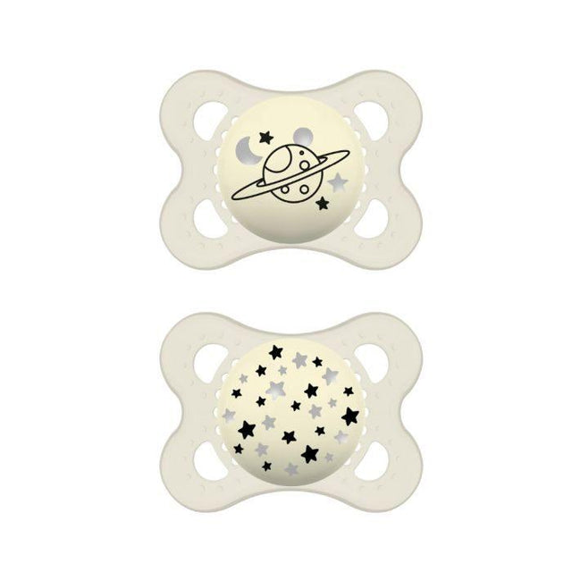 Deux sucettes MAM en silicone ivoire, motif planète et étoiles.
